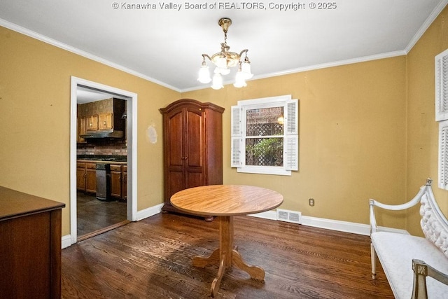 unfurnished dining area featuring a chandelier, dark wood-type flooring, and ornamental molding