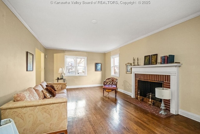 living room featuring a brick fireplace, hardwood / wood-style flooring, and ornamental molding