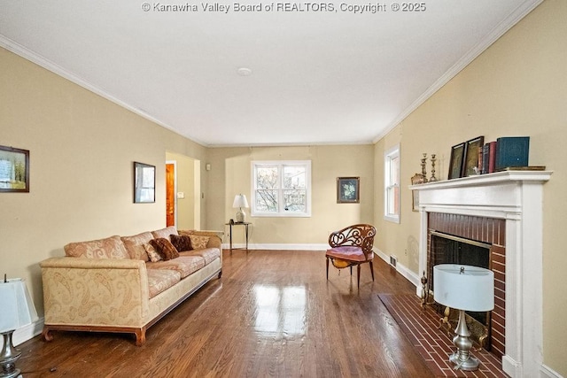 living room with a fireplace, hardwood / wood-style flooring, and crown molding