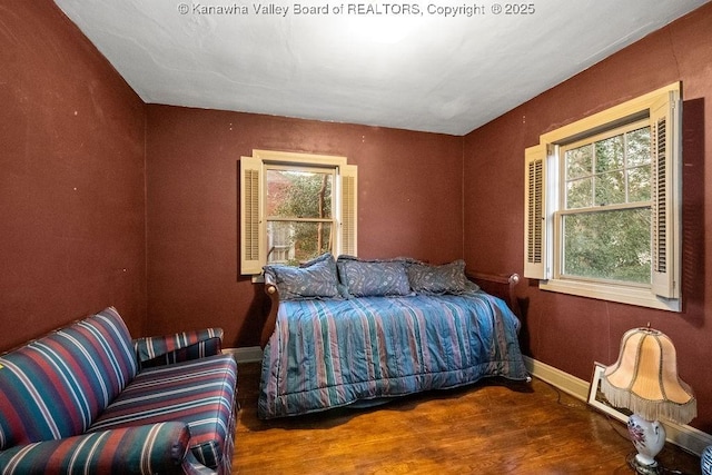 bedroom with wood-type flooring