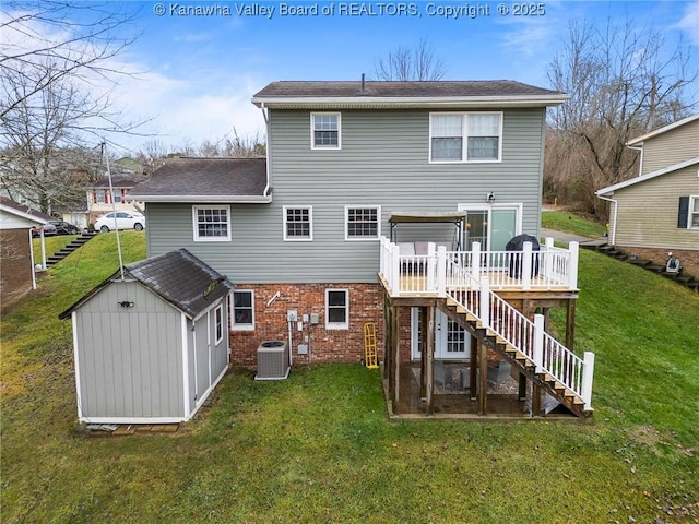 back of house with central air condition unit, a lawn, a shed, and a deck