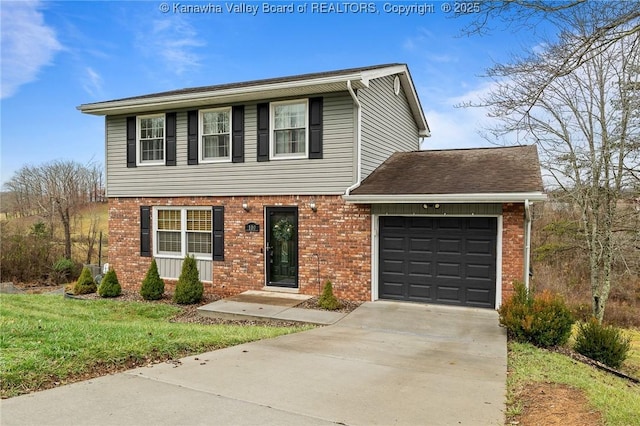 view of front of home with a garage and a front lawn