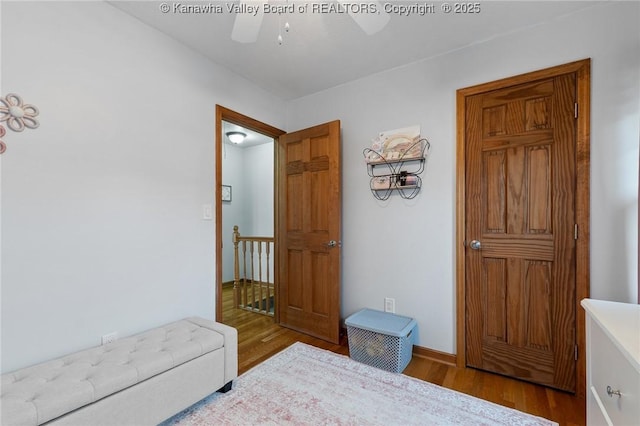 bedroom with hardwood / wood-style flooring and ceiling fan