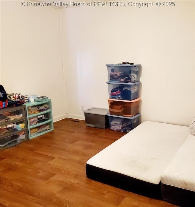 bedroom with wood-type flooring