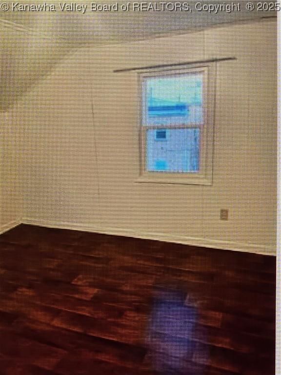 spare room featuring hardwood / wood-style flooring