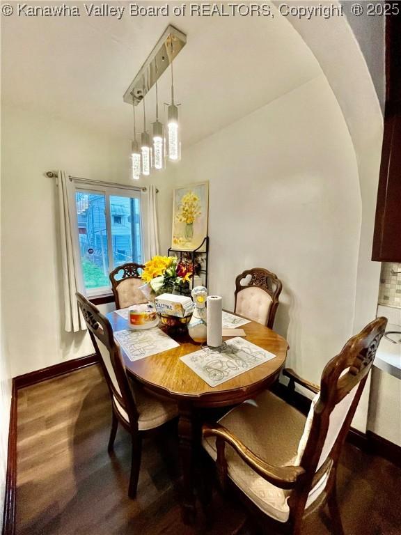 dining area with wood-type flooring