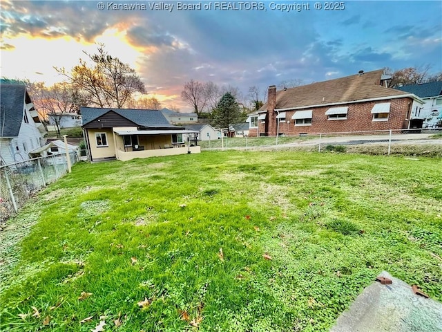 view of yard at dusk