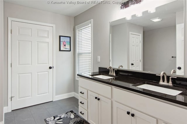 bathroom with tile patterned flooring and vanity