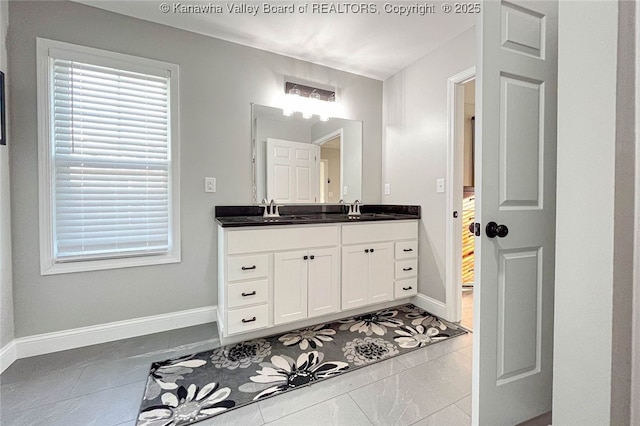 bathroom featuring tile patterned floors and vanity