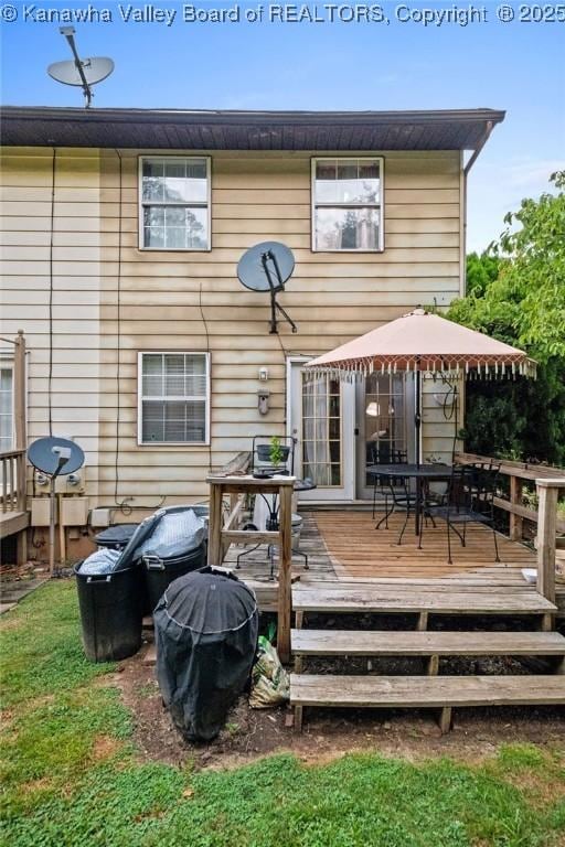 back of house with a gazebo and a deck