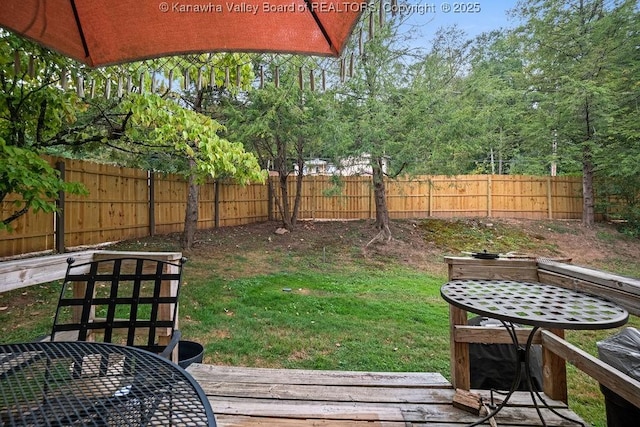 view of yard featuring a wooden deck