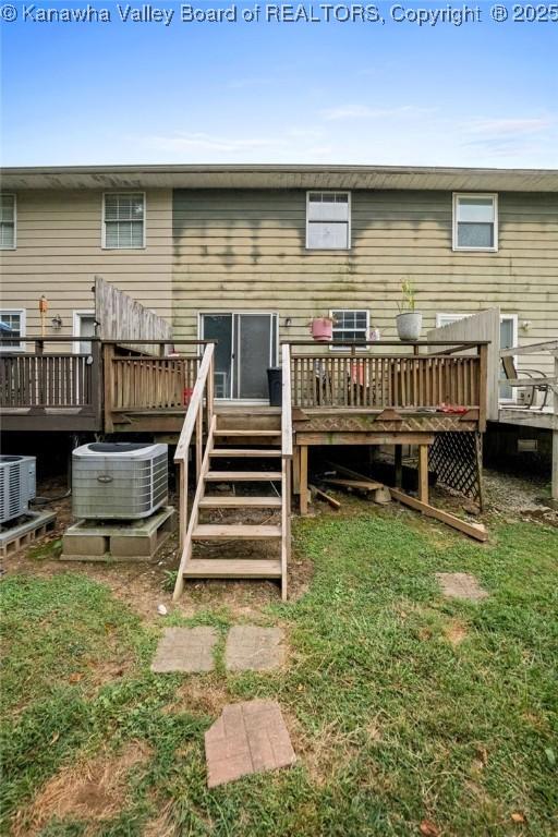 rear view of house featuring a deck and cooling unit