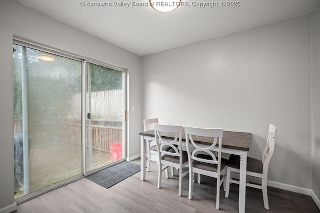 dining area featuring wood-type flooring