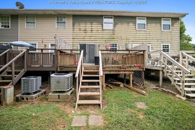 back of property with central AC and a wooden deck