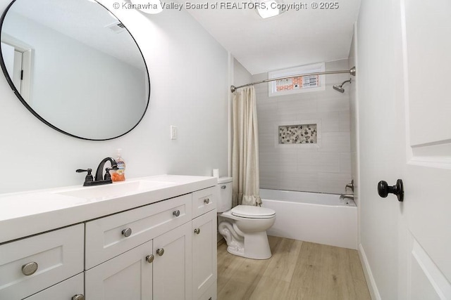 full bathroom with toilet, shower / bath combo with shower curtain, vanity, and hardwood / wood-style flooring