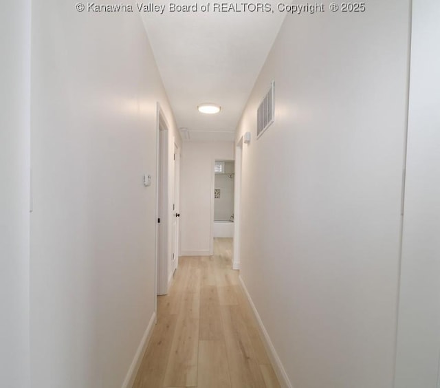 hallway featuring light wood-type flooring