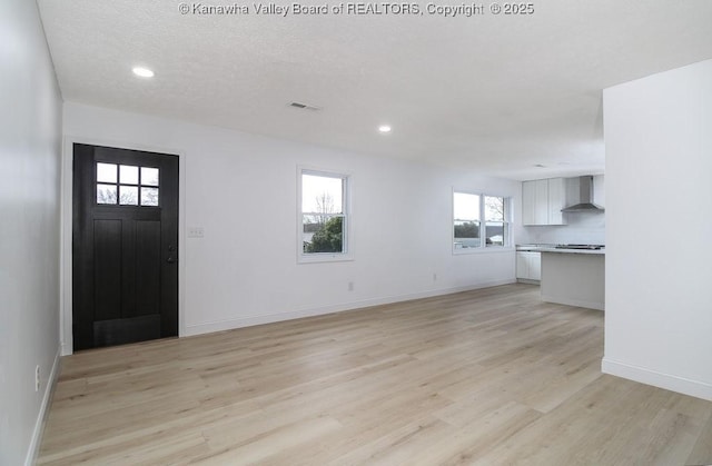 entrance foyer with light hardwood / wood-style floors