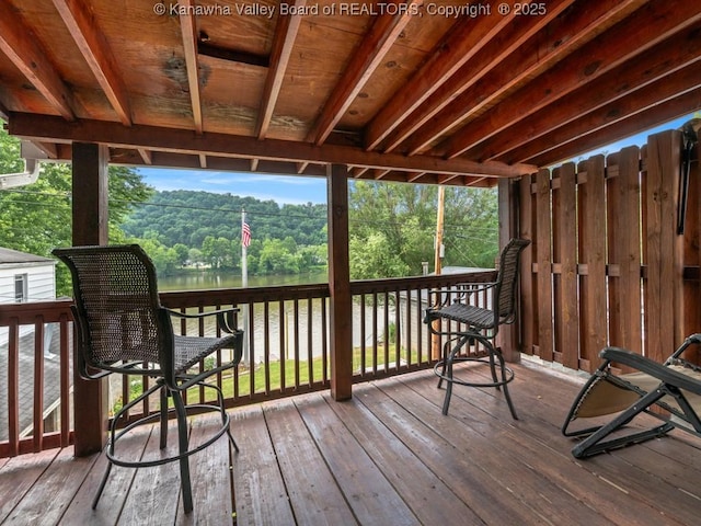 deck featuring a water view