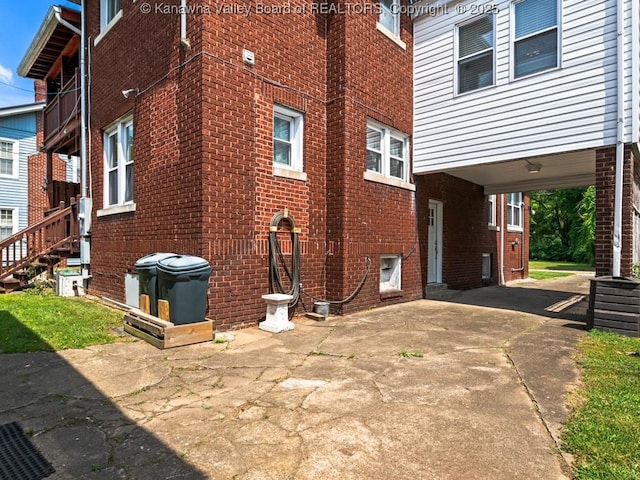 view of side of property featuring a carport