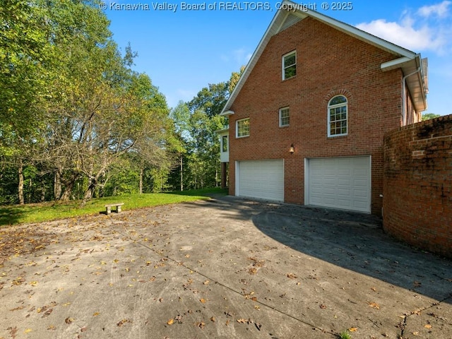 view of side of property featuring a garage