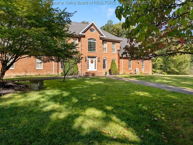 colonial inspired home with a front yard