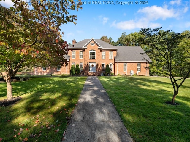 colonial-style house with a front lawn