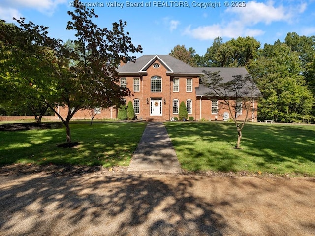 colonial home with a front lawn