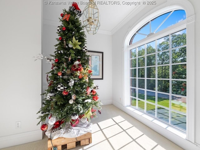 unfurnished sunroom with a healthy amount of sunlight and an inviting chandelier