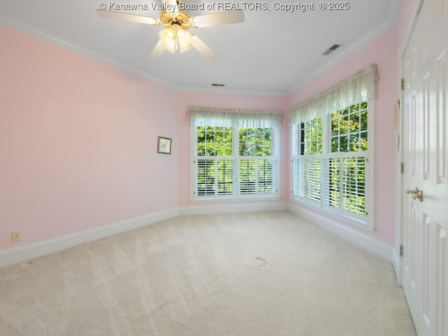 unfurnished room featuring crown molding, ceiling fan, and light carpet