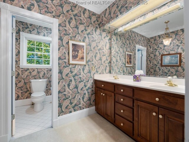 bathroom featuring vanity and toilet