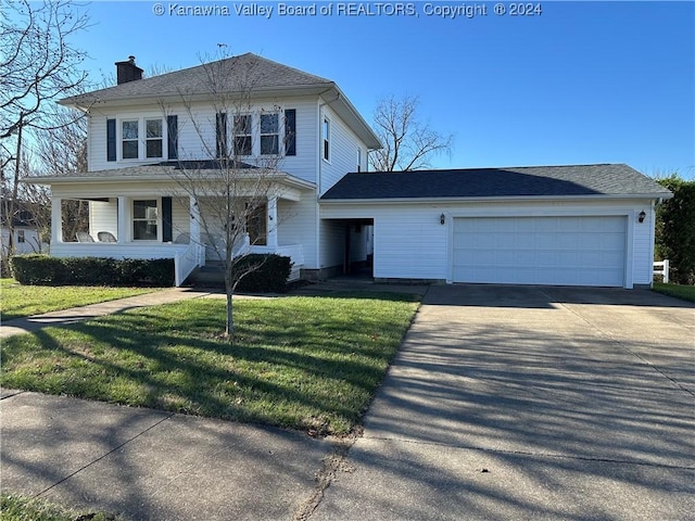 view of front of house with a front yard, a porch, and a garage