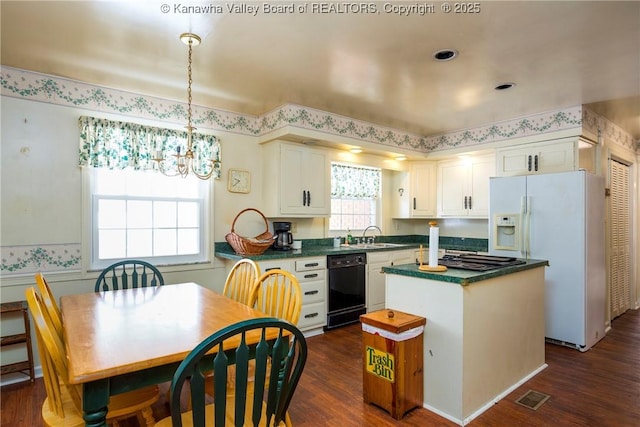 kitchen with dishwasher, white refrigerator with ice dispenser, white cabinets, dark hardwood / wood-style floors, and a kitchen island