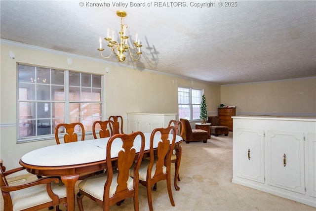 dining area featuring light carpet, a textured ceiling, a chandelier, and ornamental molding