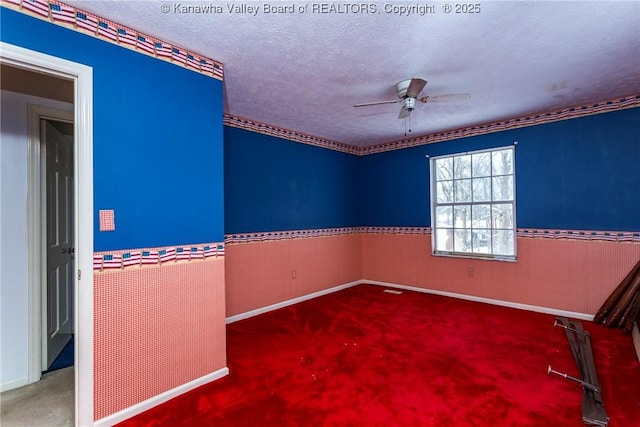 spare room featuring ceiling fan and a textured ceiling