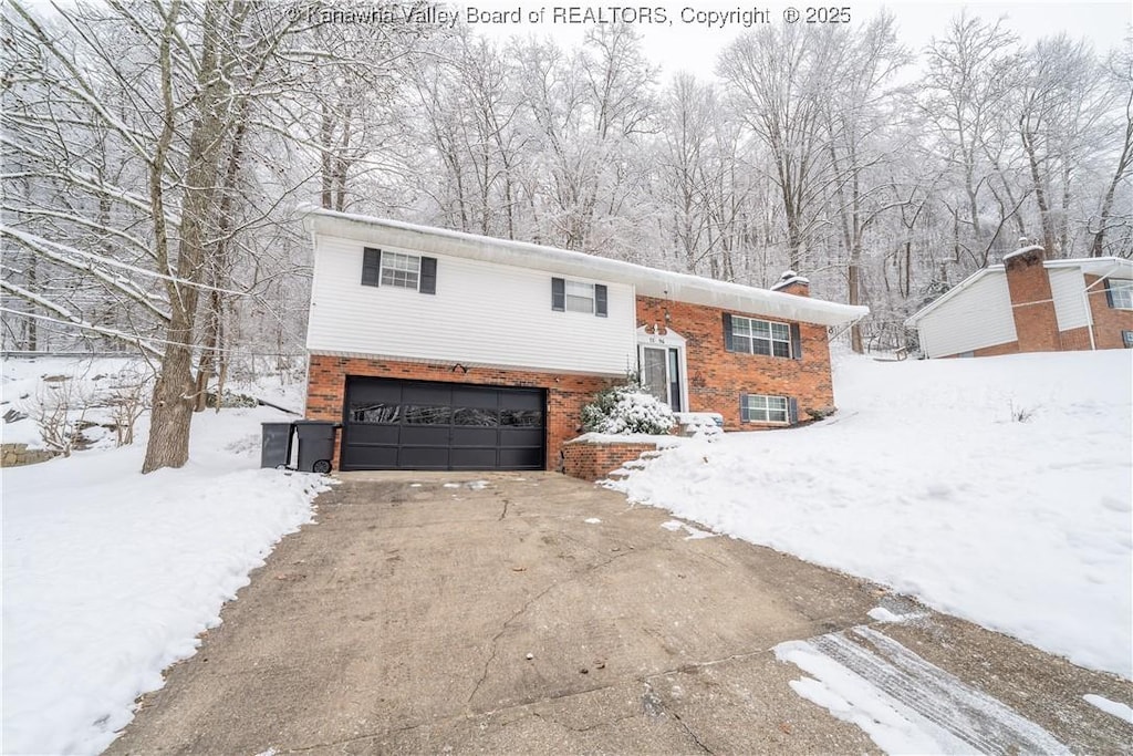 split foyer home featuring a garage