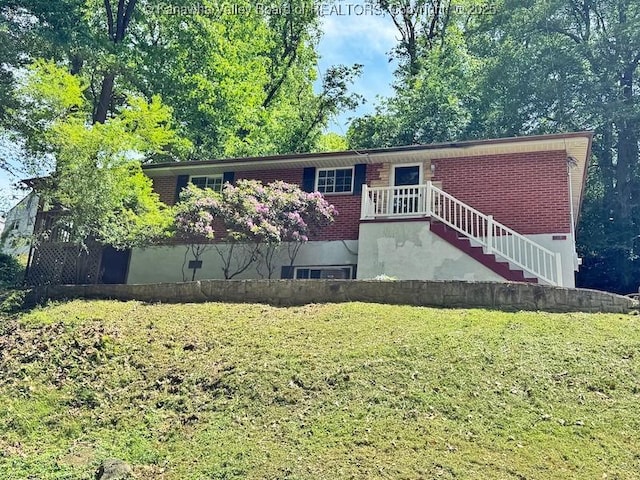 407 S St, South Charleston, WV 25303 - view of front of home with a front yard and brick siding