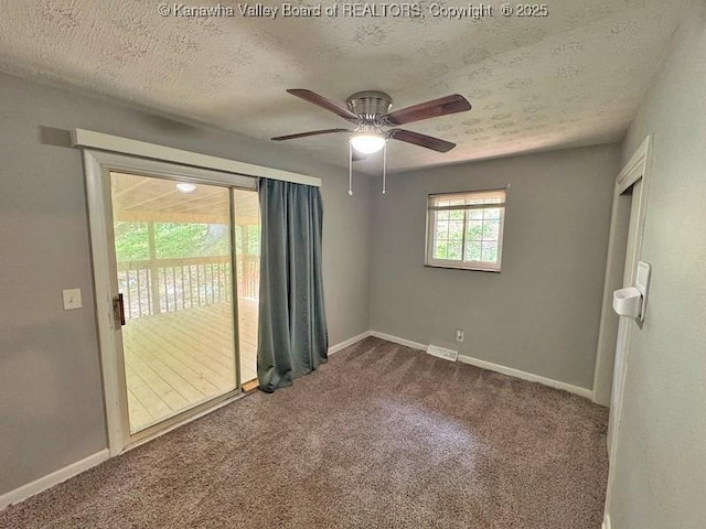 407 S St, South Charleston, WV 25303 - carpeted empty room featuring a textured ceiling, baseboards, and a ceiling fan