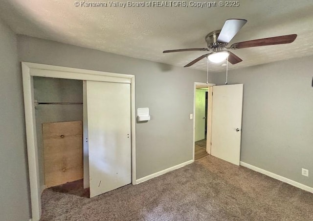 407 S St, South Charleston, WV 25303 - unfurnished bedroom featuring carpet flooring, a closet, baseboards, and ceiling fan