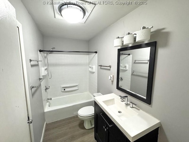 407 S St, South Charleston, WV 25303 - full bathroom featuring wood finished floors, toilet, vanity, and washtub / shower combination