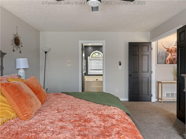 carpeted bedroom featuring ensuite bathroom