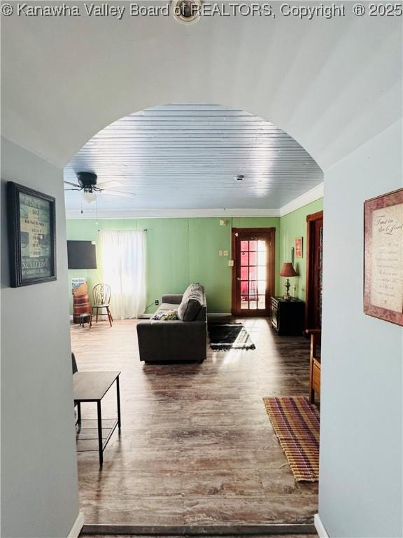 living room with hardwood / wood-style flooring, ceiling fan, a wealth of natural light, and wood ceiling