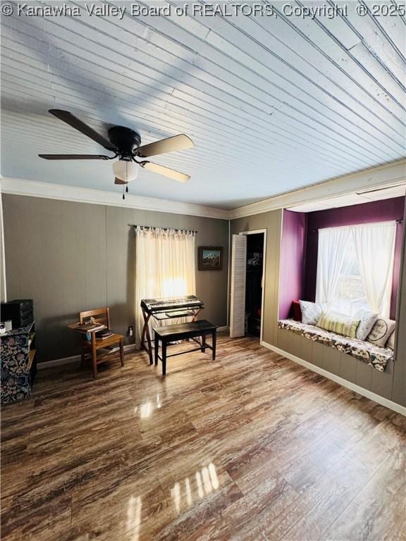 game room featuring ceiling fan, ornamental molding, wood-type flooring, and wooden ceiling