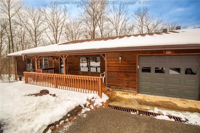 view of front of house with a porch and a garage