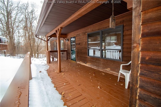 view of snow covered deck