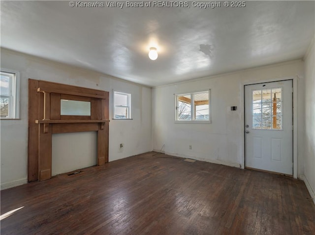 entryway featuring a healthy amount of sunlight and dark hardwood / wood-style floors