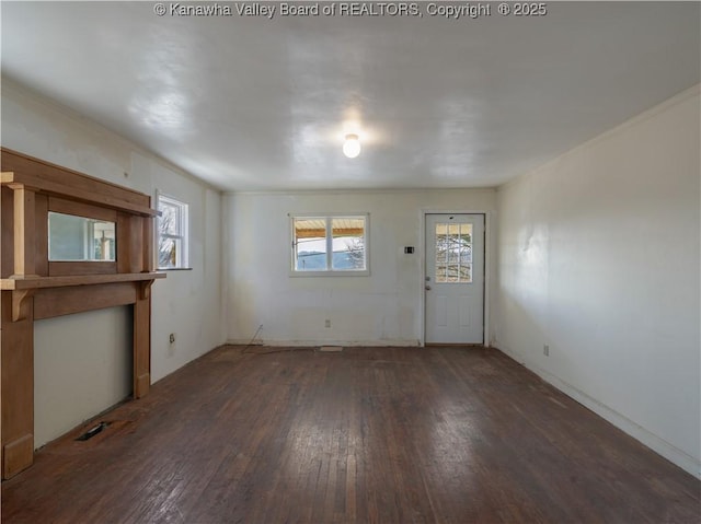 unfurnished living room featuring dark hardwood / wood-style floors