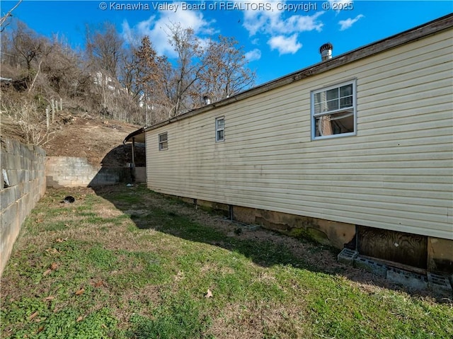 view of home's exterior featuring a lawn