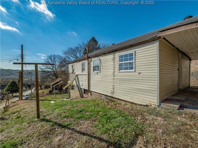 view of home's exterior featuring a yard