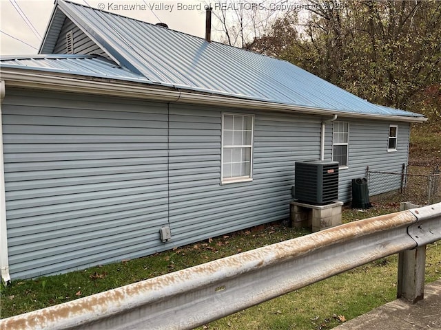 view of home's exterior with cooling unit