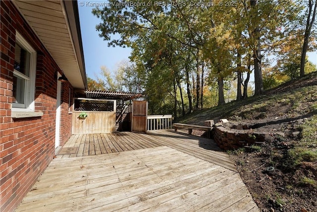 wooden deck featuring a pergola